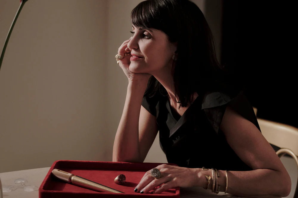 Portrait of Nada Ghazal wearing fine jewelry